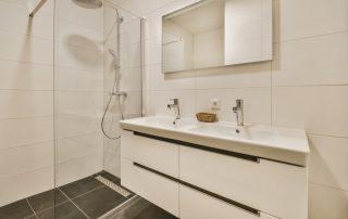 large bathroom with two faucets in vanity